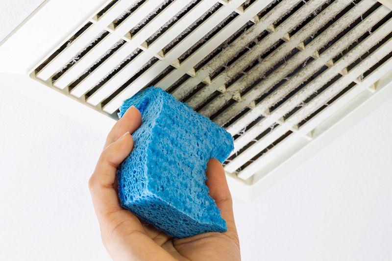 Image of someone cleaning ducts with blue sponge. Why air duct cleaning is important.