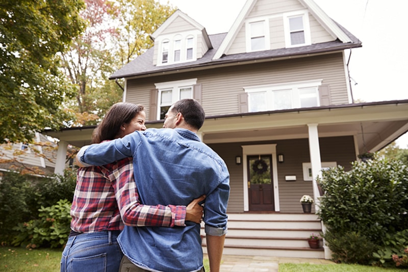 Are There Alternatives to Air Conditioning? Rear View Of Loving Couple Walking Towards House.